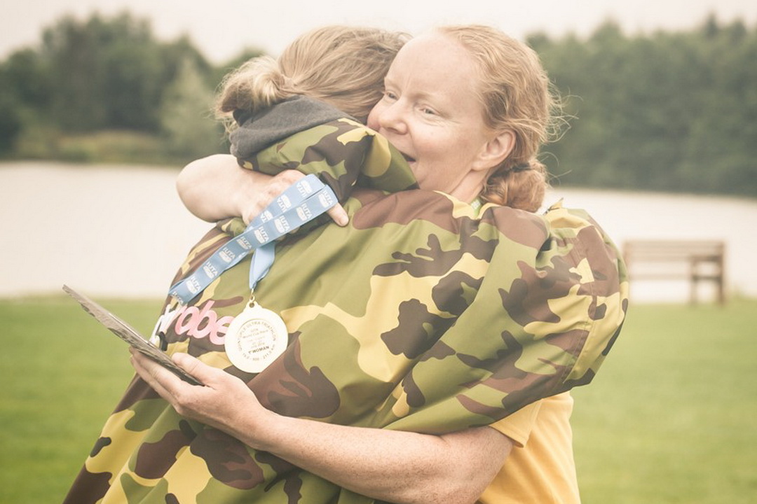 Quintuple UK 2019 - Suzy Coates at the finish line